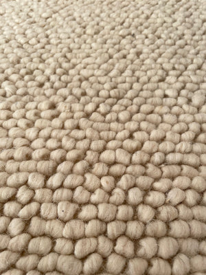 H&M Home- Alfombra de lana y algodón beige